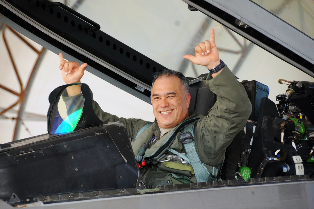 Brig. Gen. Braden K. Sakai, Commander, 154th Wing, greets family and friends upon completion of his fini-flight in an F-22 Raptor at Joint Base Pearl Harbor-Hickam, May 25, 2016. The fini-flight is a time-honored military aviation tradition marking the last flight of a pilot’s military career and/or time with a unit. Sakai retires from the U.S. Air Force after more than 30 years of service, the last five as commander of the Hawaii Air National Guard's 154th Wing. (U.S. Air National Guard photo by Senior Airman Orlando Corpuz/released)
