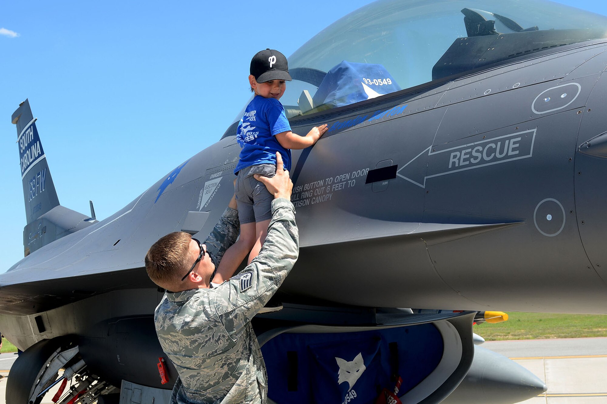 Swamp Fox Airmen and families gather during the 169th Fighter Wing Family Day for fun and fellowship at McEntire Joint National Guard Base, S.C., May 14, 2016. Local businesses and base support programs provided food and event activities to show their appreciation for the continued service of South Carolina Air National Guard and 169th Fighter Wing families and Airmen. (U.S. Air National Guard photo by Tech. Sgt. Caycee Watson)
