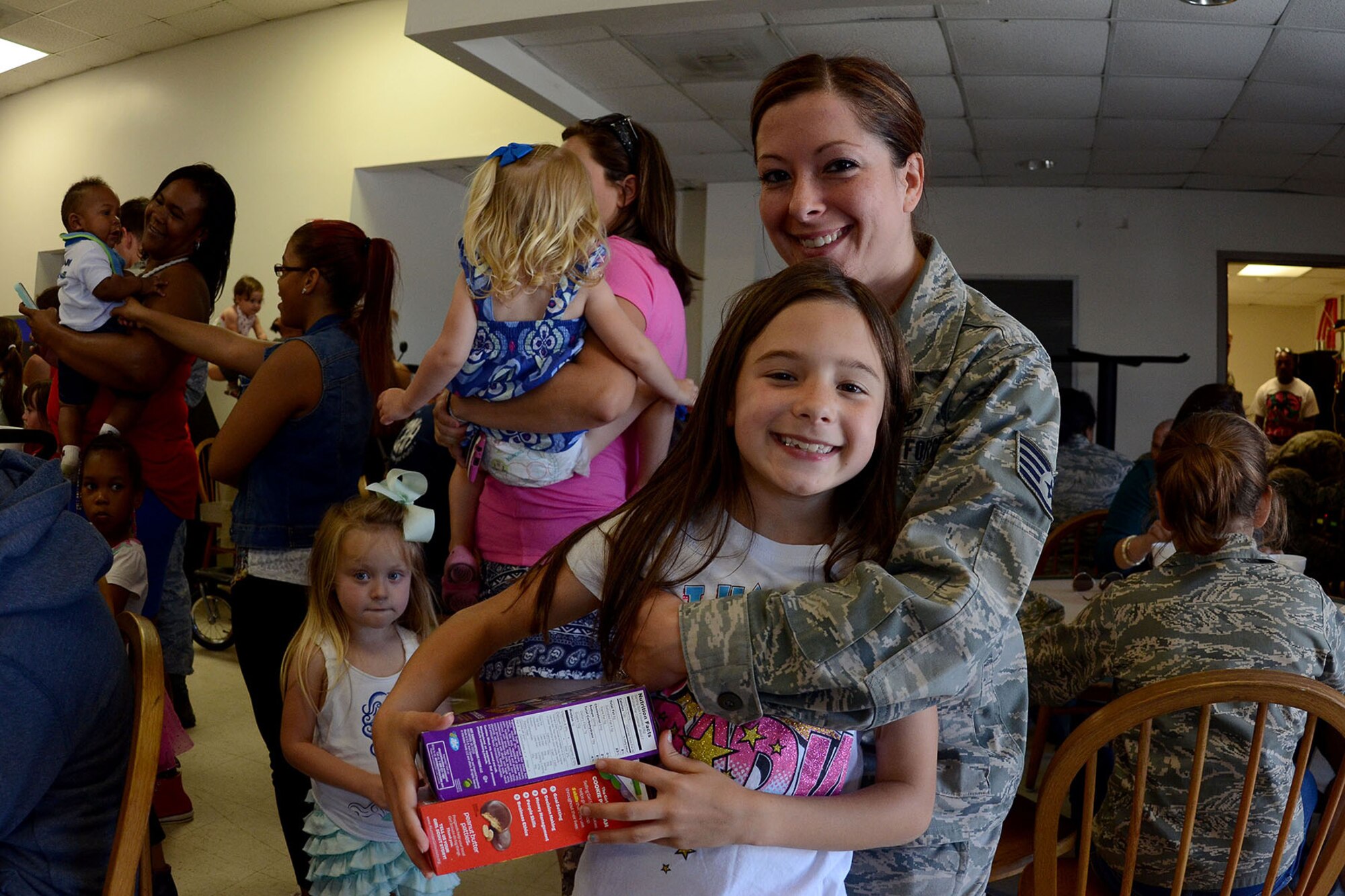 Swamp Fox Airmen and families gather during the 169th Fighter Wing Family Day for fun and fellowship at McEntire Joint National Guard Base, S.C., May 14, 2016. Local businesses and base support programs provided food and event activities to show their appreciation for the continued service of South Carolina Air National Guard and 169th Fighter Wing families and Airmen. (U.S. Air National Guard photo by Senior Airman Ashleigh S. Pavelek)