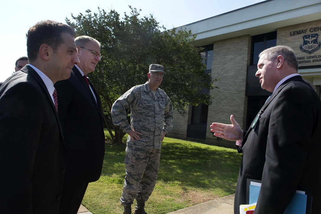 Deputy Defense Secretary Bob Work, second from left, arrives at the LeMay Center complex to participate in Schriever Wargame 2016 on Maxwell Air Force Base, Ala., May 25, 2016. Joining him was Air Force Gen. John E. Hyten, center, commander of Air Force Space Command. DoD photo by Navy Petty Officer 1st Class Tim D. Godbee