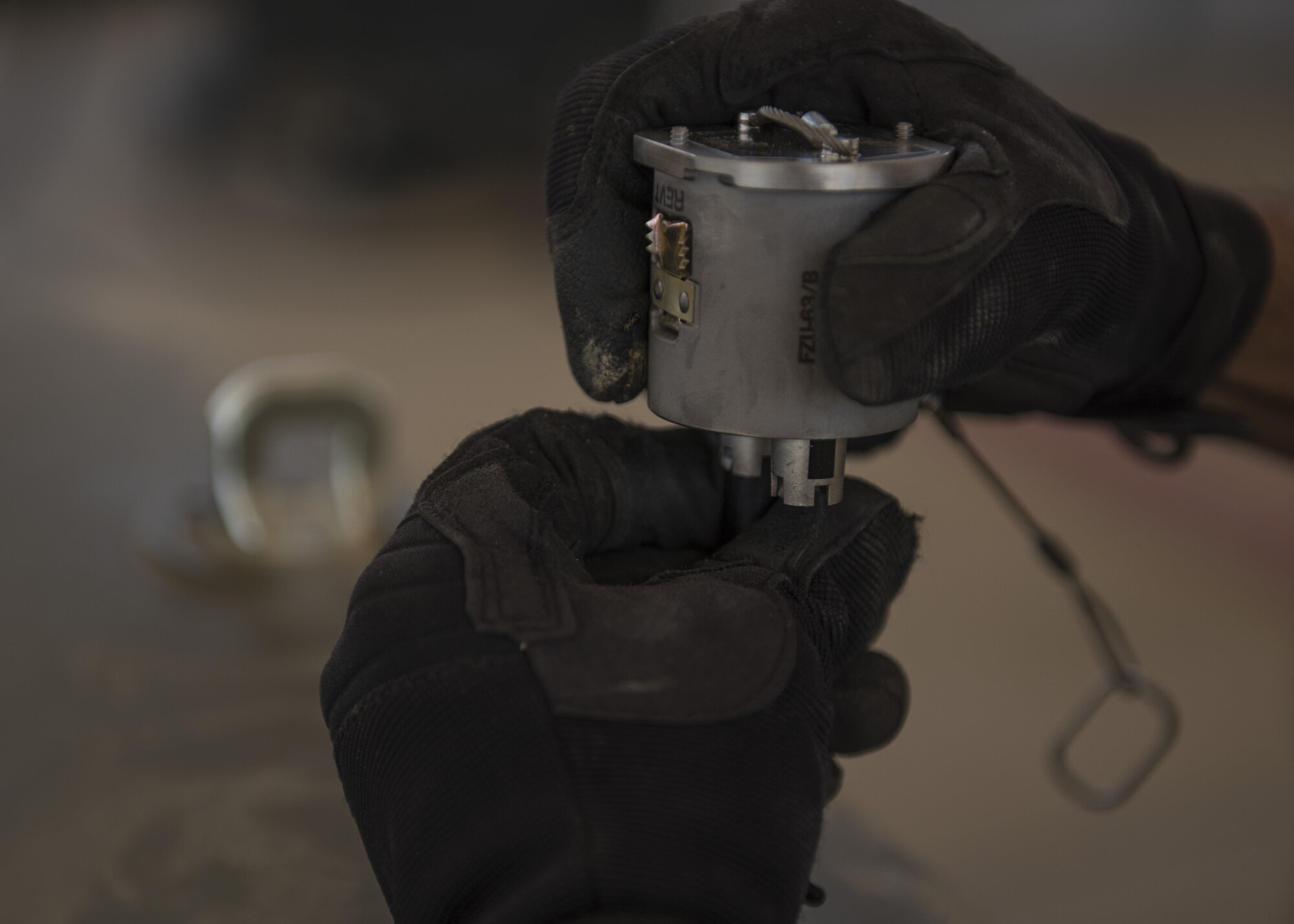 Staff Sgt. Alejandro Medina, 455th Expeditionary Maintenance Squadron Munitions Flight, munitions system specialist, helps build a GBU-54 munition at Bagram Airfield, Afghanistan, May 26, 2016. Munitions systems specialists handle, store, transport, arm and disarm weapons systems in support of counter-terrorism opertations. (U.S. Air Force photo by Senior Airman Justyn M. Freeman)