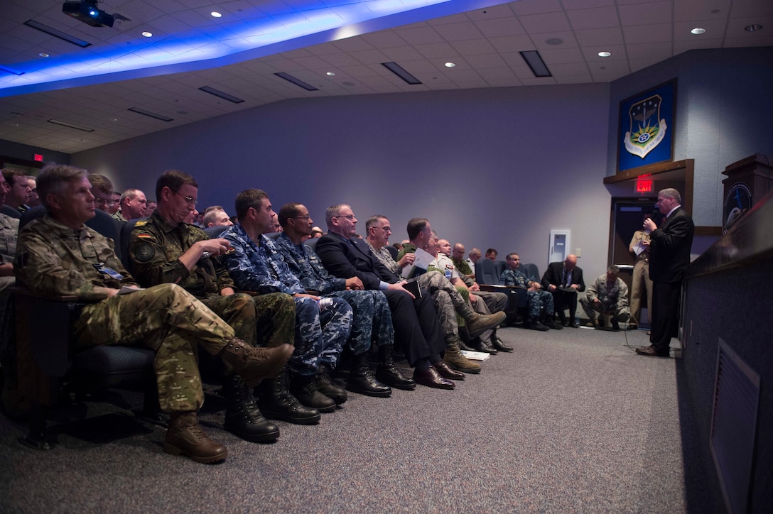 Deputy Defense Secretary Bob Work and Air Force Gen. John E. Hyten receive a briefing on Schriever Wargame 2016 at Maxwell Air Force Base, Ala., May 26, 2016. Hyten is commander of Air Force Space Command. DoD photo by Navy Petty Officer 1st Class Tim D. Godbee