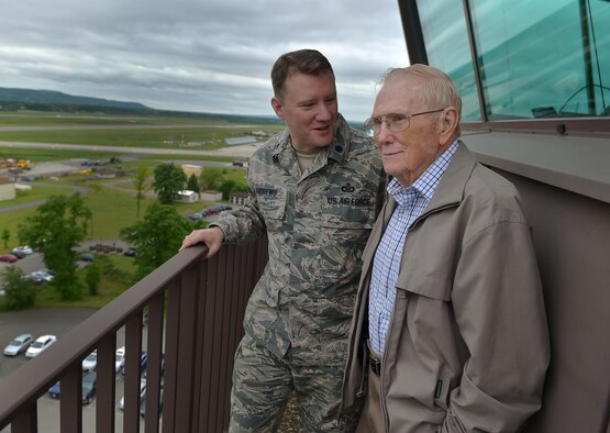 Lt. Col. Michael Andrews, the deputy director of public affairs at U.S. Air Forces Europe and Air Forces Africa, speaks with his grandfather, retired Chief Master Sgt. Kenneth Andrews, while visiting the air traffic control tower on Ramstein Air Base, Germany, May 24, 2016. Andrews entered the Air Force in 1947 and served 30 years as an air traffic controller; three of those years spent at Ramstein AB. (U.S. Air Force photo/1st Lt. Clay Lancaster)