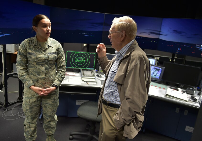Retired Chief Master Sgt. Kenneth Andrews speaks with Airman 1st Class Paige Goulette, an air traffic control apprentice, inside a simulator at the air traffic control tower on Ramstein Air Base, Germany, May 24, 2016. Andrews visited the tower to speak with the Airman on duty and share his experiences as a former air traffic controller during his 30-year Air Force career. Andrews entered the service in 1947, the same year it became an independent service. (U.S. Air Force photo/1st Lt. Clay Lancaster)