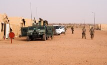 Airmen from Ramstein Air Base, Germany, prepare to convoy to an airfield near Agadez, Niger, April 29, 2016. The 435th Air Ground Operations Wing received cargo from a C-130J Super Hercules to build a base and prepare it for follow-on forces. The mission and location added new challenges with 110 degrees Fahrenheit summer heat and the potential of hostile fire.  (U.S. Air Force photo/ Jeffrey McGovern)