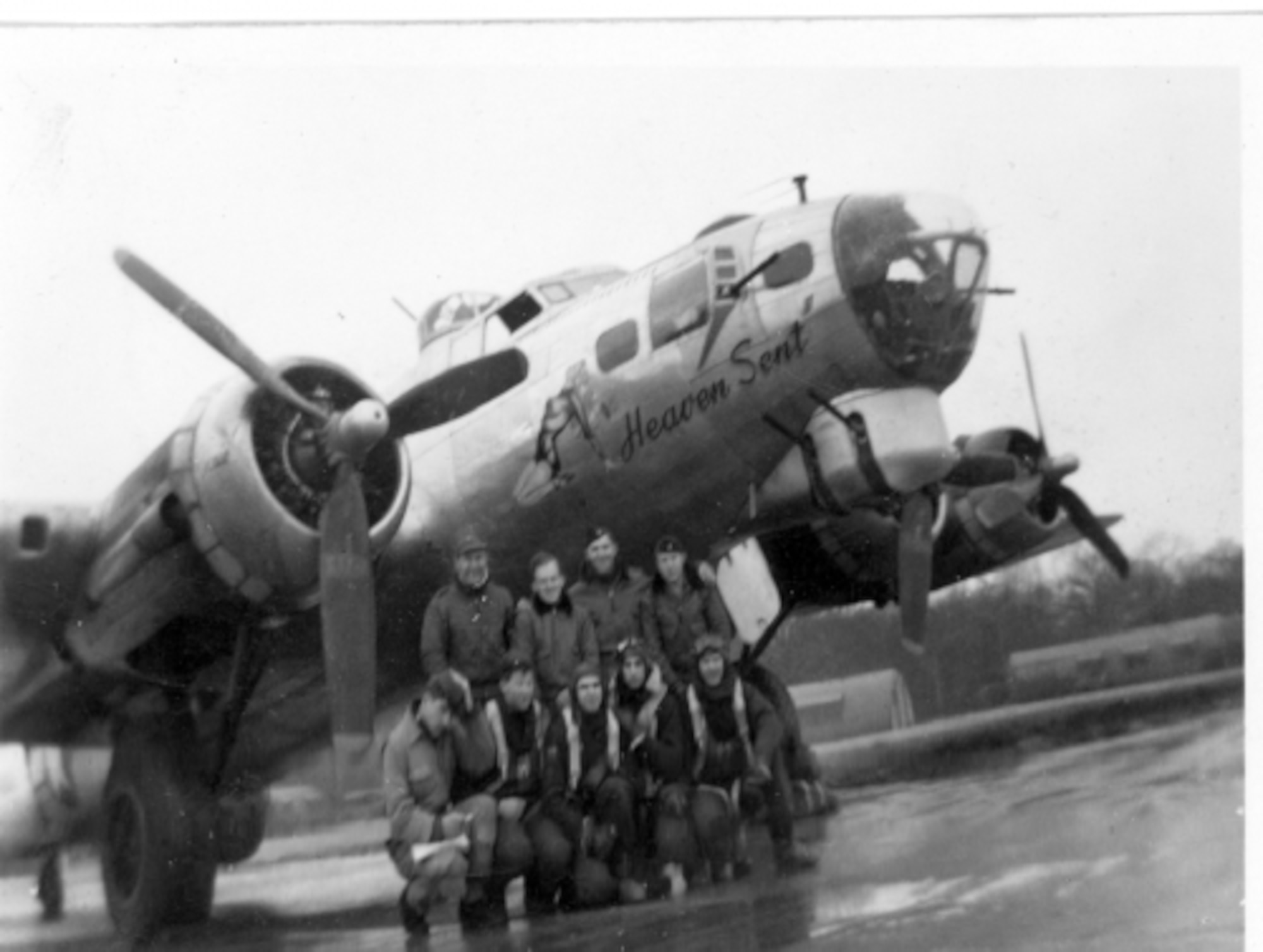 The crew of B-17 Flying Fortress "Heaven Sent" gather for a photograph with their aircraft immediately after landing from a mission over Germany during World War II. Back in 1944, Sept. 11 also brought tragedy when the 100th Bomb Group, from Thorpe Abbots, England, sent up its usual 36 aircraft. Thirteen of those were from the 350th BS; all 13 got shot down. (Courtesy photo provided by 100th Bomb Group Foundation/Released)