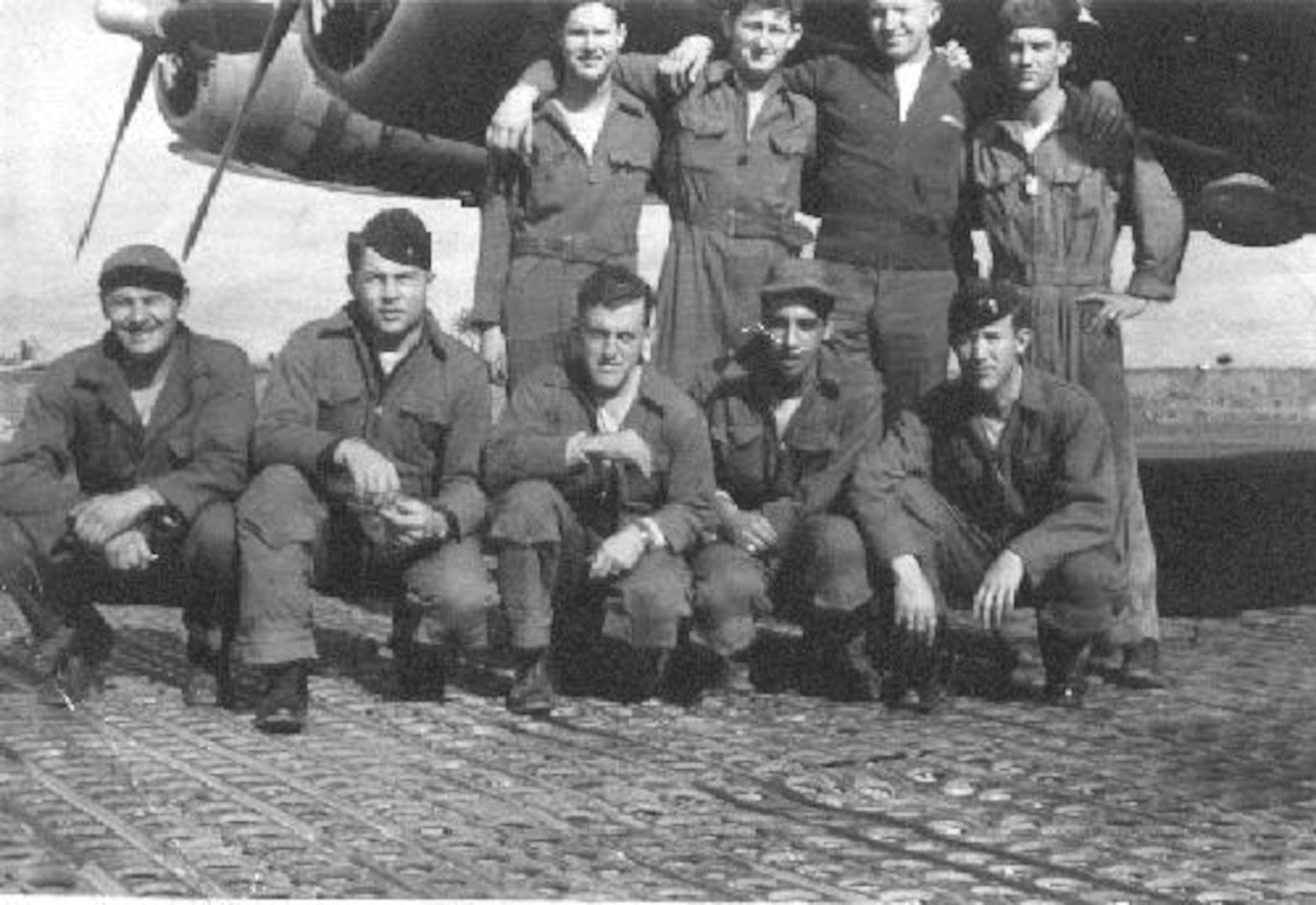 Former Staff Sgt. Lewis Herron, top left, 350th Bomb Squadron tail gunner, poses with the rest of his crew from the “Heaven Sent” B-17 Flying Fortress, standing from left to right, Tech. Sgt. Glenn Smiley, 2nd Lt. Gerald Klecker and Tech. Sgt. William Jarrell; kneeling left to right, Tech. Sgt. Michael Garemko, 1st Lt. Tom Anderson, Staff Sgt. Angelo Cioffi and 1st Lt. Fred Schmidt, during their time stationed at Thorpe Abbots, England, during World War II. The 100th BG became nicknamed “The Bloody Hundredth” after suffering significant losses. (Courtesy photo provided by the 100th Bomb Group Foundation/Released)