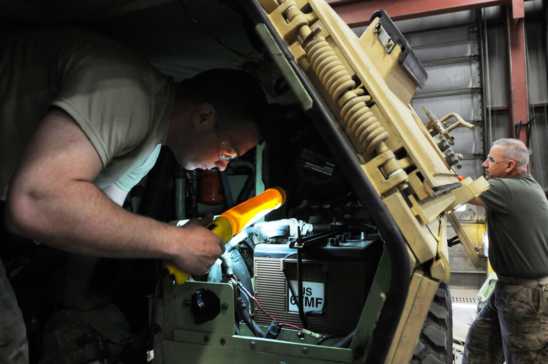 U.S. Army Reserve Soldiers Sgt. James Smith (left) and Staff Sgt. Danny Loomis, both assigned to the 818th Maintenance Support Company, conduct maintenance on an Armored Personnel Vehicle at the 88th Regional Support Command's Equipment Concentration Site 67 on Fort McCoy Wis., May 18, 2016. (U.S. Army photo by Sgt. 1st class Corey Beal)