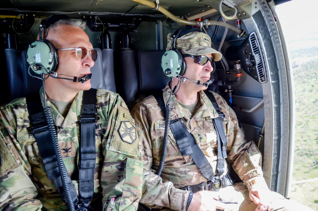 Maj. Gen. Patrick Reinert, Fort McCoy senior commander and 88th Regional Support Command commanding general (right) and Col. David Pinter, Fort McCoy garrison commander (left) conduct an aerial tour of the extensive training capabilities provided by the Range Complex on Fort McCoy, Wis., May 23.

As a Total Force Training Center, Ft. McCoy's primary responsibility is to support the training and readiness of military personnel and units of all branches and components of America's armed forces.

The 88th RSC facilitates training on Ft. McCoy through programs like Operation Platinum Support which allows Army Reserve Soldiers to gain proficiency in technical skills by providing real-world support skills while acting in direct support to the numerous exercises taking place on Ft. McCoy.

More than 300 service members will be conducting real-world hands-on training on Ft. McCoy with the 88th RSC this year as part of Operation Platinum Support.
