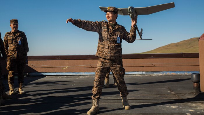 Mongolian Armed Forces Lt. Col. B. Baasaadorj practices the steps of launching an unmanned aerial vehicle during the UAV training portion of Khaan Quest 2016 at Five Hills Training Area near Ulaanbaatar, Mongolia, May 27. The training equipped MAF members with a deeper understanding of the purpose and operations of UAVs and how they can be used during peacekeeping missions. Khaan Quest 2016 is an annual, multinational peacekeeping operations exercise hosted by the Mongolian Armed Forces, co-sponsored by U.S. Pacific Command, and supported by U.S. Army Pacific and U.S. Marine Corps Forces, Pacific. Khaan Quest, in its 14th iteration, is the capstone exercise for this year’s Global Peace Operations Initiative program. The exercise focuses on training activities to enhance international interoperability, develop peacekeeping capabilities, build to mil-to-mil relationships, and enhance military readiness.