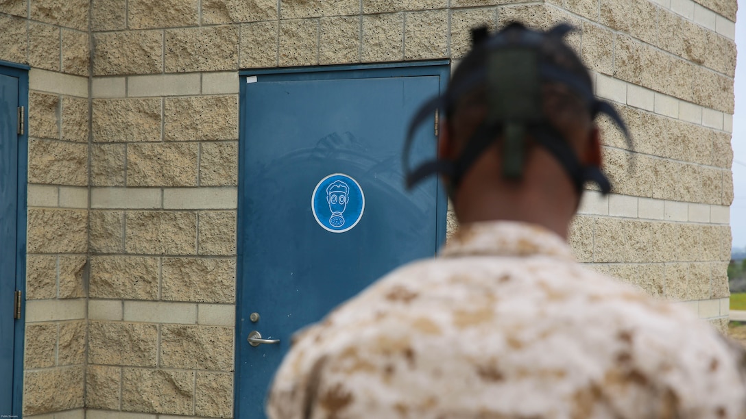 A military police officer with the Provost Marshal’s Office guards the door to the gas chamber during a Chemical, Biological, Radiological, Nuclear and High-Yield Explosives exercise aboard Marine Corps Air Station Miramar, Calif., May 18, 2016. The exercise revolved around the PMO, Miramar Fire Department, Explosive Ordnance Disposal, and Aircraft Rescue and Firefighting working together to identify and eliminate the threat of a simulated clandestine drug lab. 