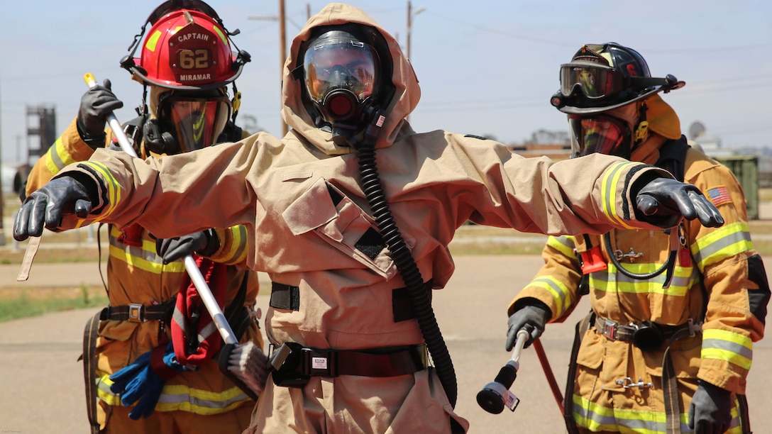 Firefighters with the Marine Corps Air Station Miramar Fire Department decontaminate a Marine with Explosive Ordnance Disposal after he entered the contaminated area during a Chemical, Biological, Radiological, Nuclear and High-Yield Explosives exercise at the gas chamber aboard Marine Corps Air Station Miramar, Calif., May 19, 2016. The exercise revolved around PMO, the Miramar Fire Department, Explosive Ordnance Disposal, and Aircraft Rescue and Firefighting working together to identify and eliminate the threat of a simulated clandestine drug lab. 