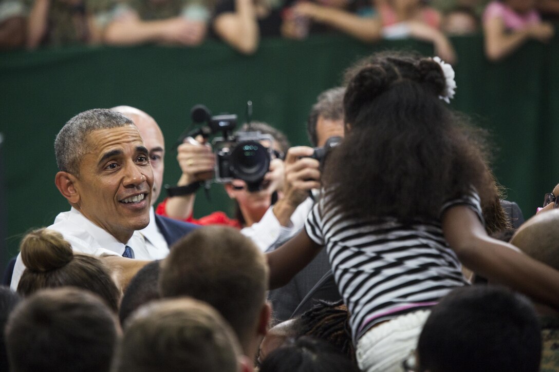 President Barack Obama greets service members and their families after a Troop Talk at Marine Corps Air Station Iwakuni, Japan, May 27, 2016. Obama is the highest ranking U.S. government official to visit MCAS Iwakuni and the Hiroshima Peace Memorial Park.  (U.S. Marine Corps photo by Justin Fishe/Released)