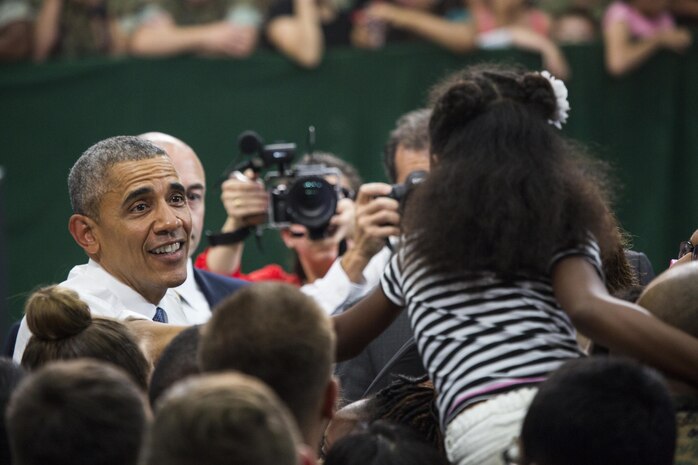 President Barack Obama greets service members and their families after a Troop Talk at Marine Corps Air Station Iwakuni, Japan, May 27, 2016. Obama is the highest ranking U.S. government official to visit MCAS Iwakuni and the Hiroshima Peace Memorial Park.  (U.S. Marine Corps photo by Justin Fishe/Released)