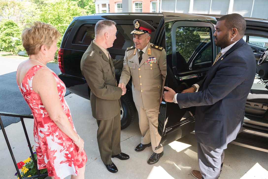 Marine Corps Gen. Joe Dunford, center left, chairman of the Joint Chiefs of Staff, shakes hands with Lt. Gen. Mahmoud Hegazy, chief of staff of Egypt's armed forces, as he arrives at Joint Base Myer-Henderson Hall, Va., May 26, 2016. DoD photo by Army Staff Sgt. Sean K. Harp