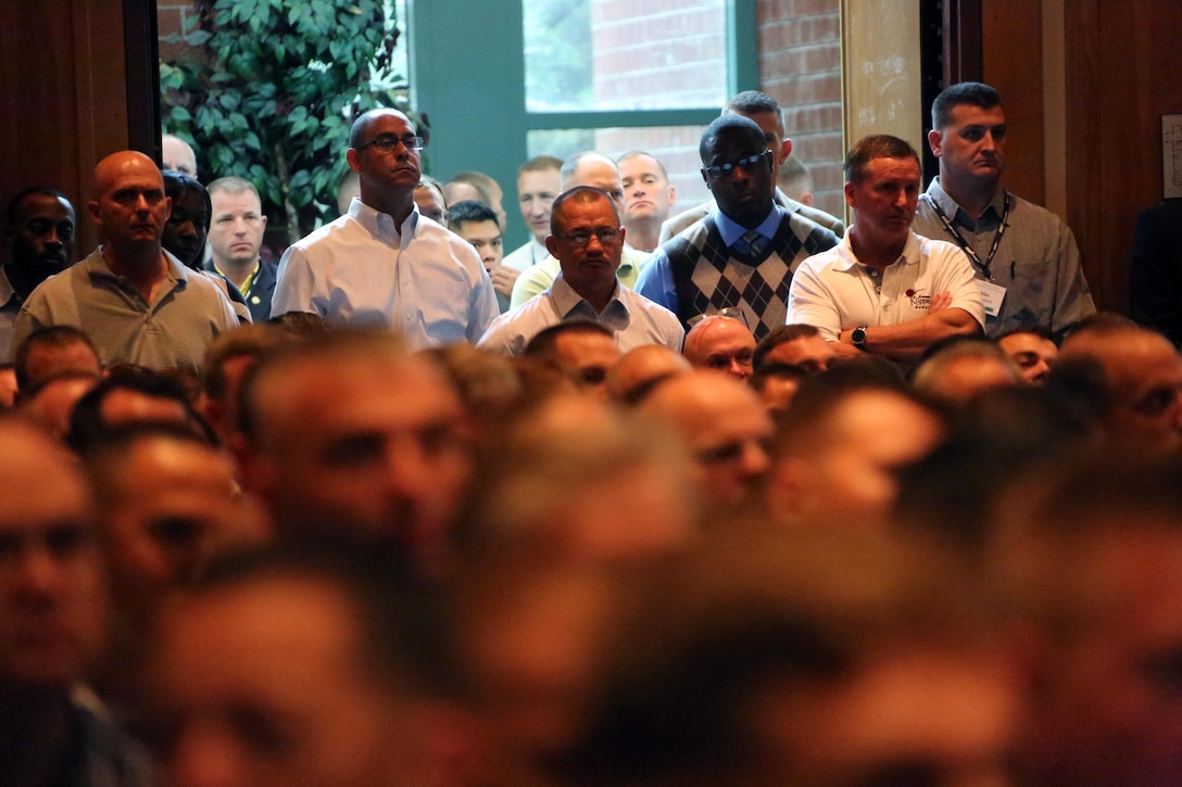 Attendees gather for  a brief  during the 45th Annual Marine Corps Aviation Association Symposium and Marine Aviation Summit at New Bern, N.C., May 17, 2016. Hundreds of naval aviators gathered at the convention center for the opening brief to the weeklong event. Senior leaders gathered to discuss the future of Marine Corps aviation and the steps the Corps is taking to reach its set goals. (U.S. Marine Corps photo by Cpl. N.W. Huertas/Released)