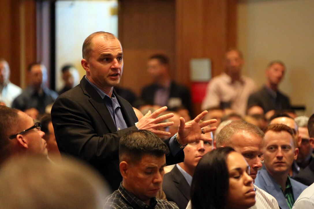 Attendees give feedback  during the 45th Annual Marine Corps Aviation Association Symposium and Marine Aviation Summit at New Bern, N.C., May 17, 2016. Hundreds of naval aviators gathered at the convention center for the opening brief to the weeklong event. Senior leaders gathered to discuss the future of Marine Corps aviation and the steps the Corps is taking to reach its set goals.(U.S. Marine Corps photo by Cpl. N.W. Huertas/Released)
