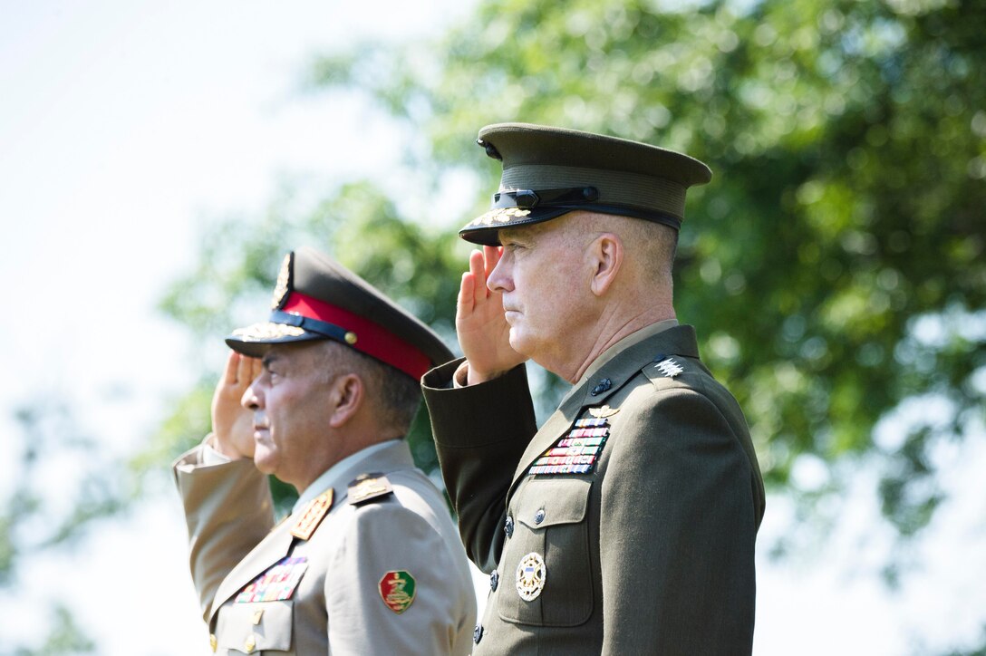 Marine Corps Gen. Joe Dunford, right, chairman of the Joint Chiefs of Staff, salutes during a full honors arrival ceremony to welcome Lt. Gen. Mahmoud Hegazy, chief of staff of Egypt's armed forces, at Joint Base Myer-Henderson Hall, Va., May 26, 2016. DoD photo by Army Staff Sgt. Sean K. Harp 