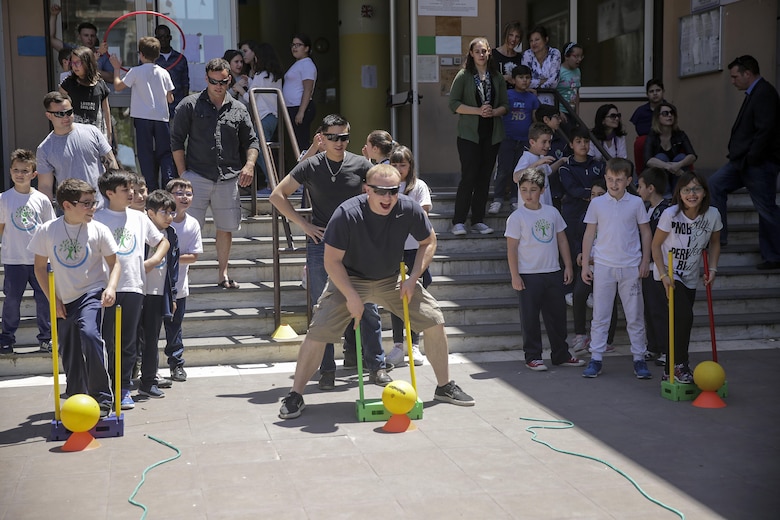 RPSA Alexander Varner, a religious program specialist with Special Purpose Marine-Air Ground Task Force Crisis Response-Africa, gets ready to run the circuit course with the children at 3rd Circolo Didattico ‘’Giovanni Paolo II’’ Gravina Di Catania, Italy, May 18, 2016.  The Marines and sailors interacted with the children, going over some English for an upcoming test, as well as creating and participating in games during the children’s recess period. (U.S. Marine Corps photo by Cpl. Alexander Mitchell/released)