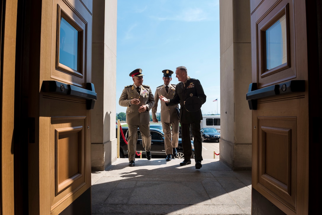 Marine Corps Gen. Joe Dunford, right, chairman of the Joint Chiefs of Staff, walks into the Pentagon with Lt. Gen. Mahmoud Hegazy, chief of staff of Egypt's armed forces, May 26, 2016. DoD photo by Army Staff Sgt. Sean K. Harp