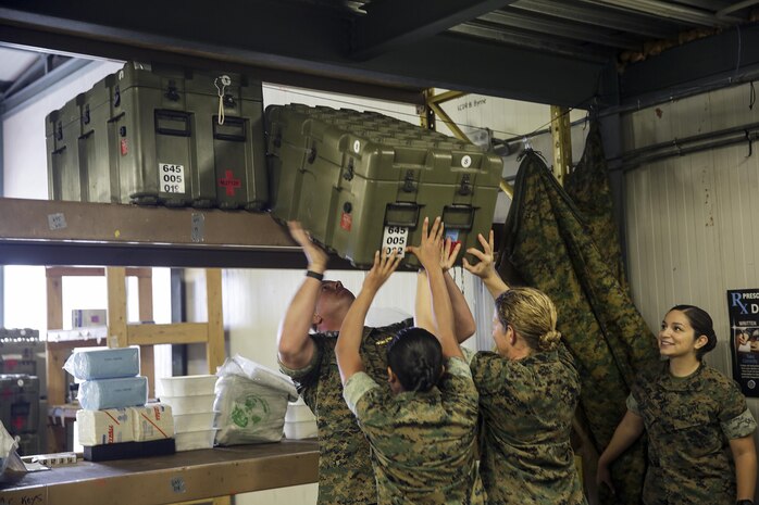 Sailors with the Forward Resuscitative Surgical System-Shock Trauma Platoon organize boxes and crates after being weighed and numbered for shipping on Naval Air Station Sigonella, Italy, May 2, 2016.  Some of the FRSS-STP capabilities include basic trauma resuscitation with supplementation of fluids and blood products, basic general surgeries to stop internal bleeding and stabilizing fractures to prevent further injuries to a patient.  (U.S. Marine Corps photo by Cpl. Alexander Mitchell/released)