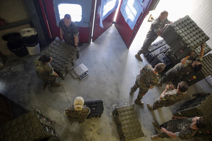 Sailors with the Forward Resuscitative Surgical System-Shock Trauma Platoon are preparing crates and boxes, filled with medical supplies, for shipping on Naval Air Station Sigonella, Italy, May 2, 2016.  The mission of the FRSS-STP is to sustain life and limb, maintain a fighting force as a theater asset and respond to all medical calls. (U.S. Marine Corps photo by Cpl. Alexander Mitchell/released)