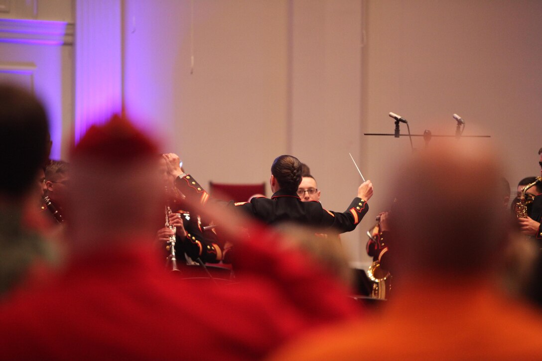 Staff Sgt. Katherine Genovese conducts the band as the band members play the national anthem and veterans salute during the Salute to the Troops event in Garner, N.C., May 22, 2016. Comprised of more than 40 Marines, the 2nd Marine Aircraft Wing band strives to share the Marine Corps’ traditions, values and esprit de corps with the local community. The band also supports local military units and squadrons by performing for change of command ceremonies, retirements, and other military events. The band is scheduled to perform during the Memorial Day Celebration in New Bern, N.C, Monday. Genovese is the enlisted conductor for the 2nd MAW Band. 