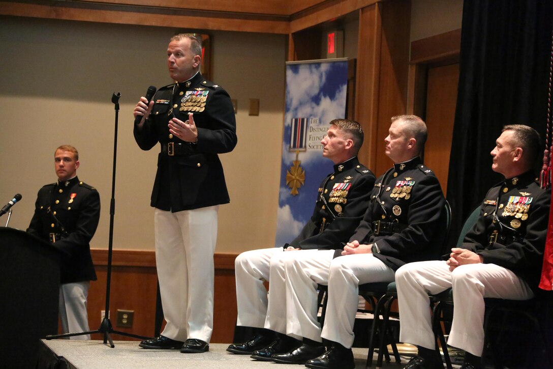 Senior leaders in aviation give opening remarks on stage during a winging ceremony at New Bern, N.C., May 19, 2016. Naval aviators received the prestigious honor of receiving an iconic emblem, depicting the culmination of years of training, perseverance and sacrifice. Pilots and crewmen receive wings once they complete their respective training requirements and are then designated to join the fleet as an operational Marine Corps asset. The winging ceremony took place during the 45th Annual Marine Corps Aviation Association Symposium and Marine Corps Aviation Summit. ( U.S. Marine Corps photo by Cpl. N.W. Huertas/ Released)