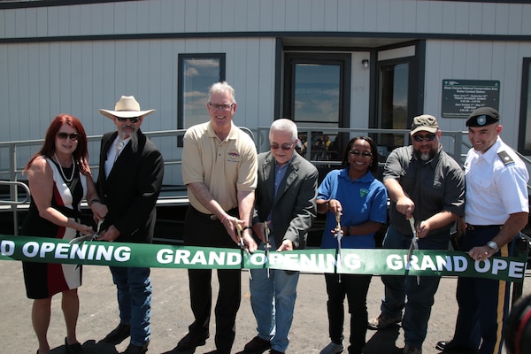 Lt. Col. Dennis Sugrue, Los Angeles District deputy commander, participates in a ribbon-cutting ceremony in front of a temporary contact station at the Sloan Canyon National Conservation Area May 19. The District oversaw construction of the road and adjacent trail, bike lanes, and parking.