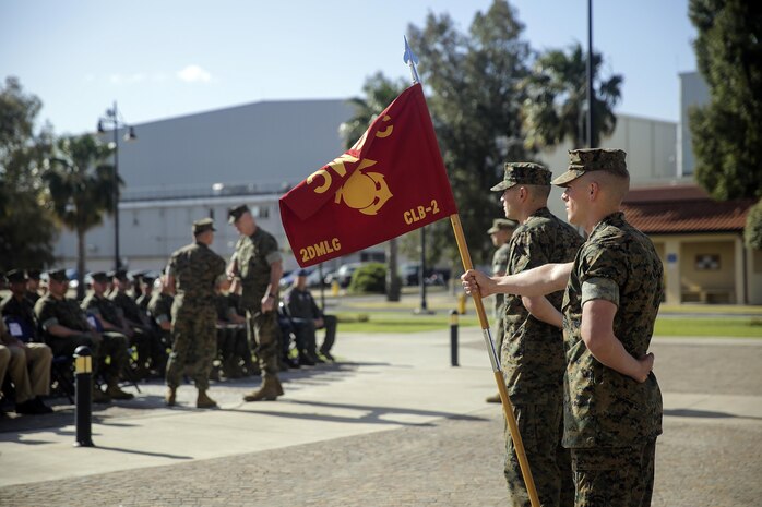 A Marine with Combat Logistics Battalion 2, stands at parade rest with the Battalion’s guidon during the transfer of authority ceremony on April 25, 2016, at Naval Air Station Sigonella, Italy.  Lt. Col. Matthew Hakola, the Commanding Officer for CLB-6, transferred authority of Special Purpose Marine Air-Ground Task Force Crisis Response-Africa Logistics Combat Element to Lt. Col. Randall Jones, the Commanding Officer of CLB-2. (U.S. Marine Corps photo by Cpl. Alexander Mitchell/released)