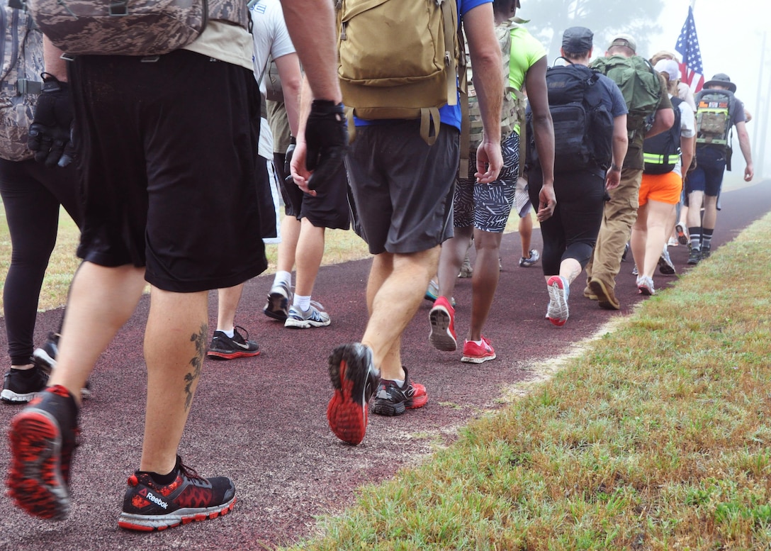 Airmen from across the 919th Special Operations Wing head out on a GoRuck Challenge event May 12, 2016 at Duke Field, Fla. The teambuilding exercise, based on special operations fitness training, put participants through a five-hour series of physically and mentally exhausting scenarios along an eight-mile ruck march.  (U.S. Air Force photo/Dan Neely)