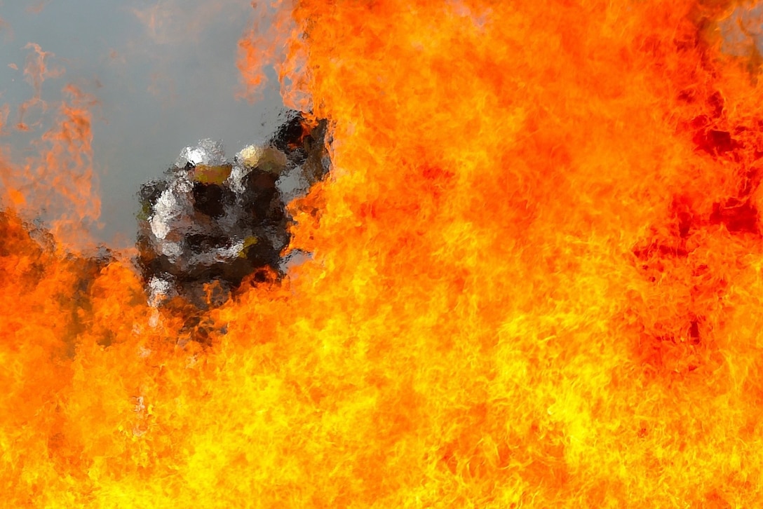 Airmen with the 121st Civil Engineering Squadron Fire Department put their firefighting skills to use during a live fire training exercise May 20, 2016, at Rickenbacker Air National Guard Base, Ohio. Training exercises like these are held to ensure confidence within firefighters when it comes to real-world situations. (U.S. Air National Guard photo/Master Sgt. Ralph Branson)