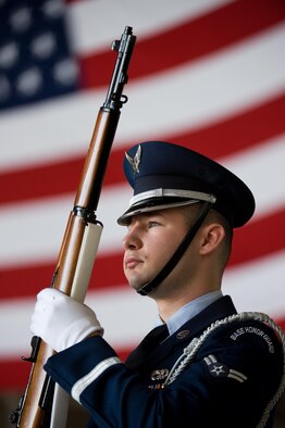 Dover Air Force Base Honor Guard member Airman 1st Class Andrew Des Marias stands at the position of port arms prior to the start of the 436th Maintenance Group change of command ceremony May 24, 2016, on Dover AFB, Del. Des Marias is assigned to the 436th Aerial Port Squadron as a fleet service specialist when not performing honor guard duties. (U.S. Air Force photo/Roland Balik)