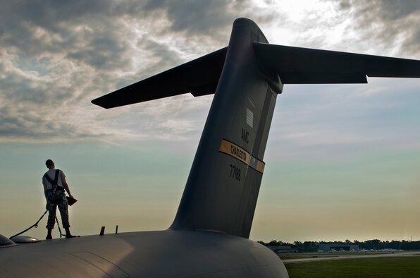 Airman Bradley Williams, a 437th Aerospace Maintenance Squadron crew chief, inspects a C-17 Globemaster III as part of Crescent Reach 16 on May 24, 2016, at Joint Base Charleston, S.C. Crescent Reach is an annual exercise designed to test and evaluate Joint Base Charleston’s ability to mobilize and launch a large aircraft formation in addition to train, process and deploy Airmen and cargo in response to a simulated crisis board. (U.S. Air Force photo/Senior Airman Ericka Engblom)