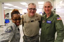 932nd Airlift Wing Medical Group members from the Aeromedical Staging Squadron and Medical Squadron received skills training during a challenging exercise at Patrick Air Force Base, Fla.  Seen here after many hours on the job, and in between litter-carrying of patients, are Senior Master Sgt. Gayla Gibson, Lt. Col. Stephen Secraw and Lt. Col. Isaac Faibisoff.  (U.S. Air Force photo by Maj. Stan Paregien)