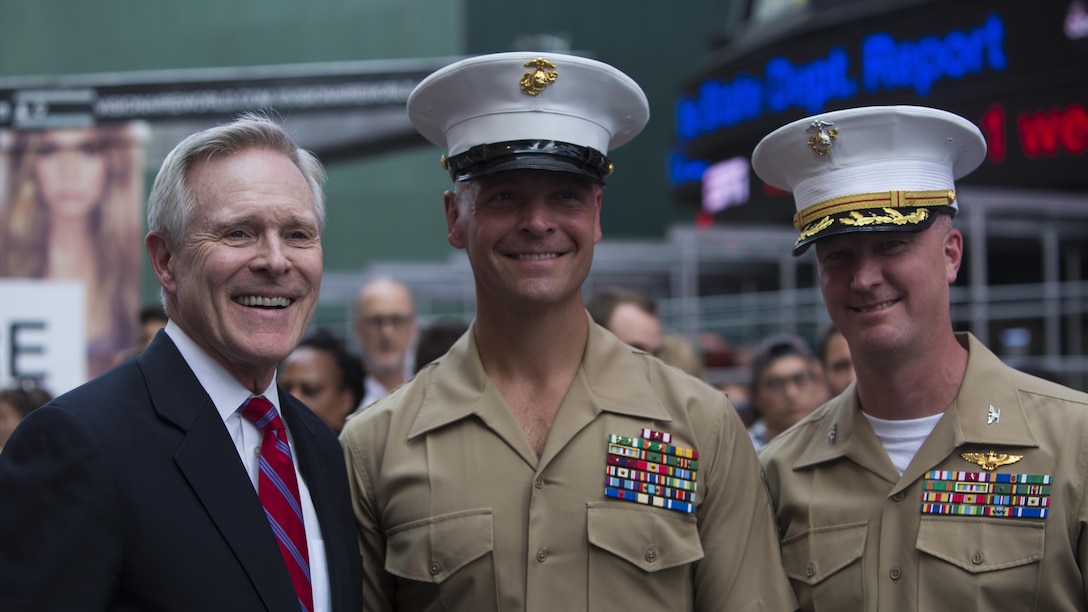 Secretary of the Navy Ray Mabus poses for a photo with a Col. Ryan Rideout, commanding officer, 24th Marine Expeditionary Unit, and Sgt. Maj. Douglas Cutsail III, sergeant major, 24th MEU, during Fleet Week New York in Times Square, May 26, 2016. The Marines and sailors are visiting the city to interact with the public, demonstrate capabilities and teach the people of New York about America’s maritime services.