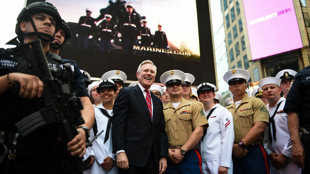 The U.S. Secretary of the Navy Ray Mabus poses for a photo with a group of Marines and Sailors during Fleet Week New York in Times Square, May 26, 2016. The Marines and Sailors visited the city to interact with the public, demonstrate capabilities and teach the people of New York about America's sea services.