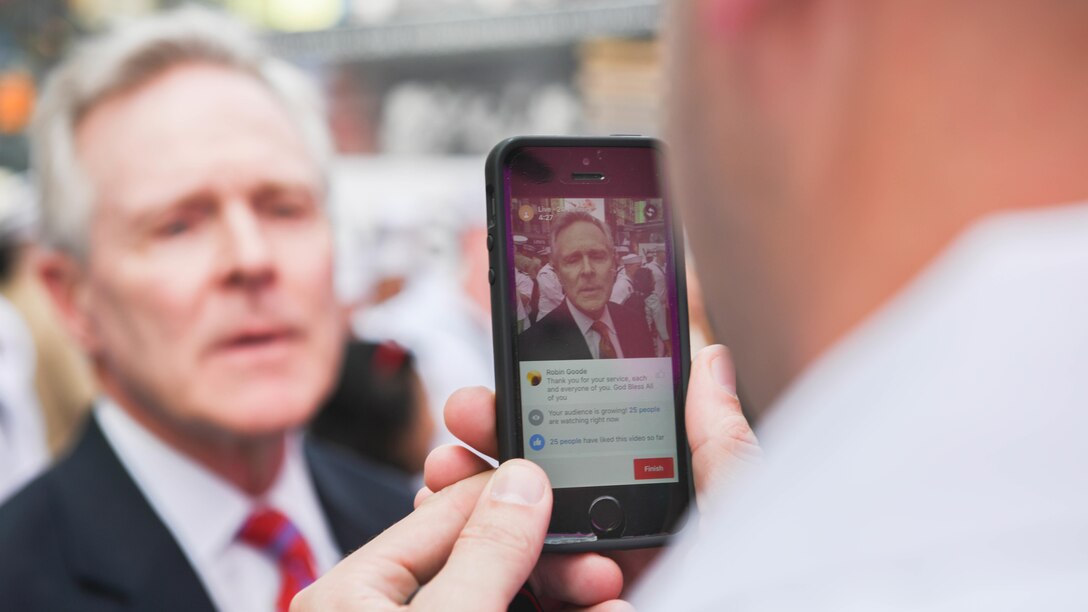 Secretary of the Navy Ray Mabus gives a motivational speech to Marines and sailors through Periscope during Fleet Week New York in Times Square, May 26, 2016. The Marines and sailors are visiting the city to interact with the public, demonstrate capabilities and teach the people of New York about America's sea services. 