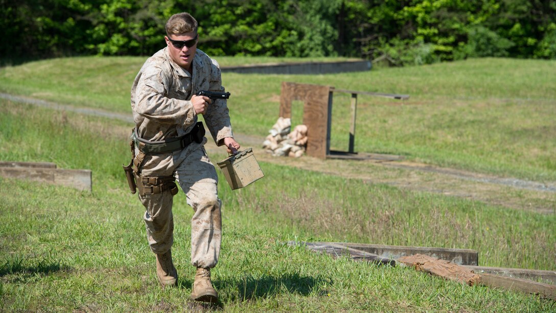 A competitor runs through a course at the Marine Corps Shooting Team championships at Marine Corps Base Quantico, Virginia, May 25, 2016. The shooters were required to carry ammo cans in this segment to add combat realism in the competition. 