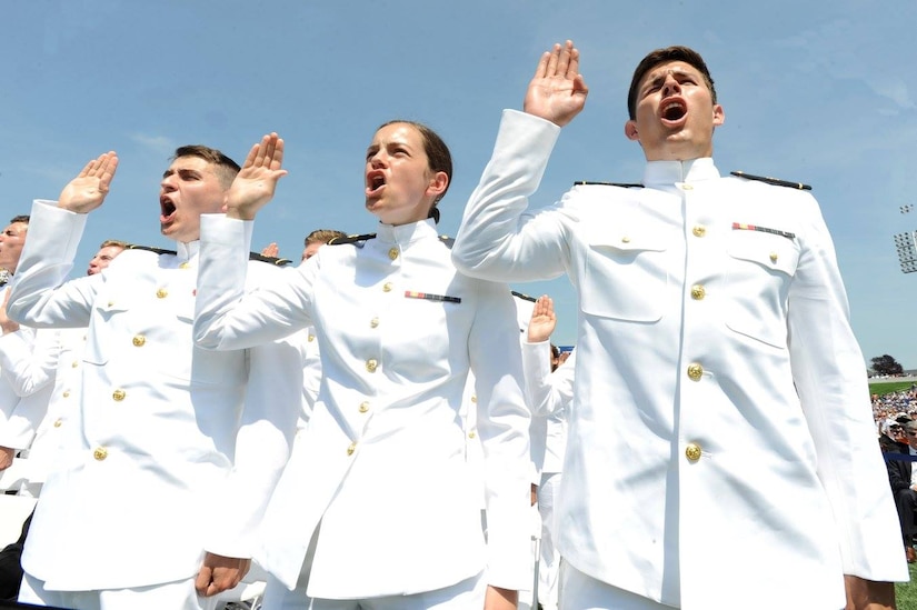 Midshipmen are commissioned as Navy ensigns at the graduation and commissioning at the U.S. Naval Academy in Annapolis, Maryland, May 27, 2016. Navy photo