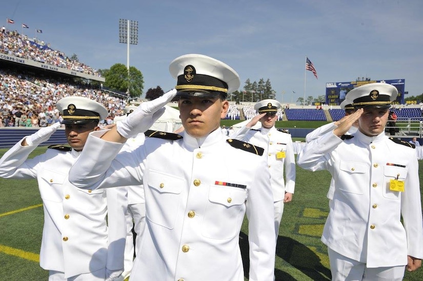 Midshipmen salute at the graduation and commissioning at the U.S. Naval Academy in Annapolis, Maryland, May 27, 2016. Navy photo