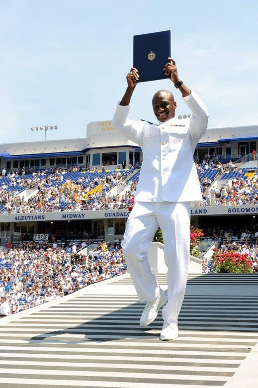 A newly commissioned officer celebrates during the graduation and commissioning at the U.S. Naval Academy in Annapolis, Maryland, May 27, 2016. Navy photo