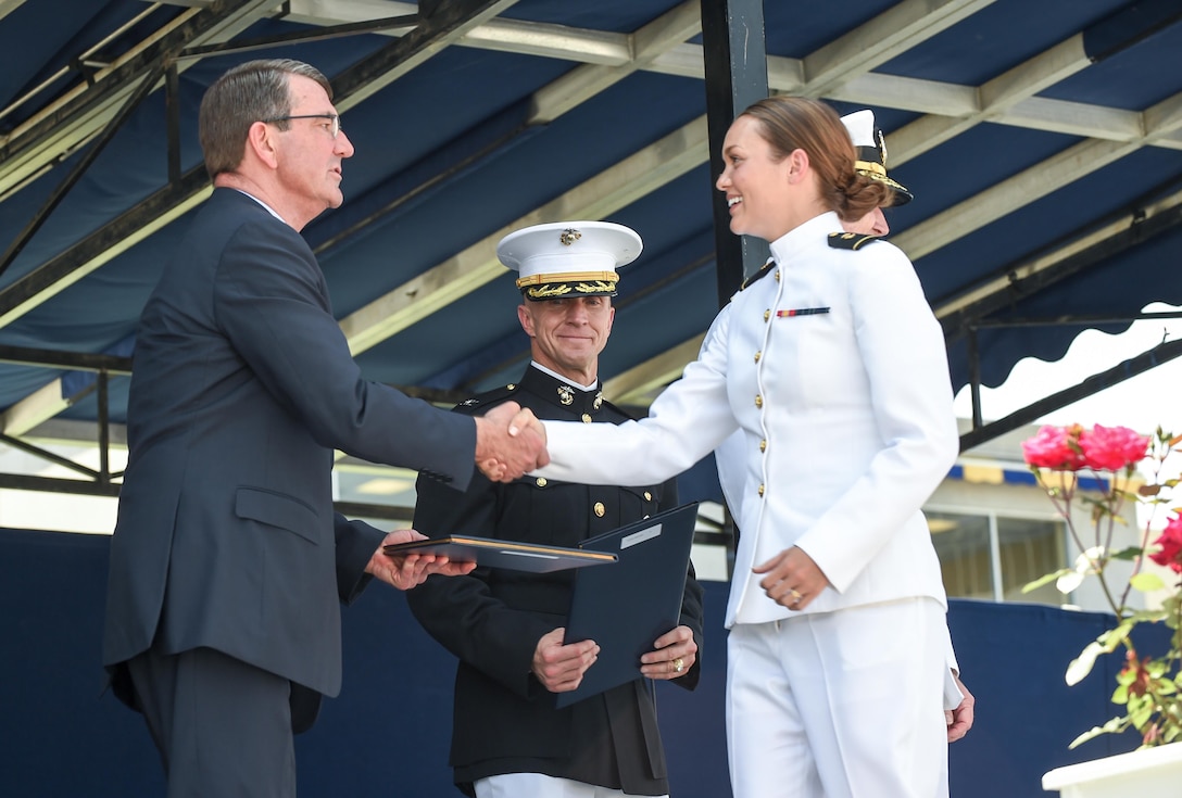 Defense Secretary Ash Carter congratulates a graduate during the commencement ceremony at the U.S. Naval Academy in Annapolis, Md., May 27, 2016. DoD photo by Army Sgt. 1st Class Clydell Kinchen