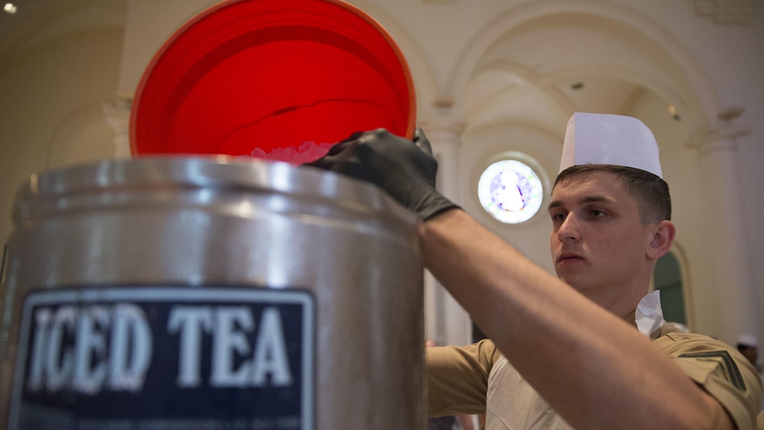 U.S. Marine Corps Cpl. Richard Miller, network data technician with the 24th Marine Expeditionary Unit, prepares iced tea at the Holy Apostles Soup Kitchen in New York, May 27, 2016 during Fleet Week. U.S. Marines, sailors and coast guardsmen visited the city to interact with the public, demonstrate capabilities and teach the people of New York about America's sea services.