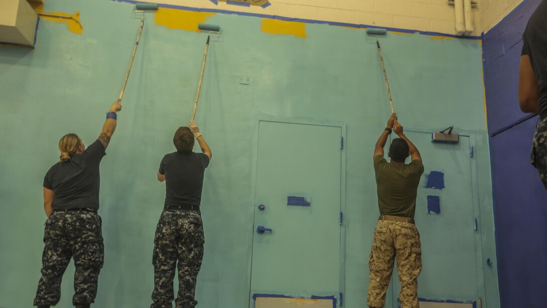 Service members with the 24th Marine Expeditionary Unit paint the gymnasium of the Graham Windham’s Manhattanville Cornerstone Community Center in Manhattan, New York, May 27, 2016. The Marines are visiting the city to interact with the public, demonstrate capabilities and teach the people of New York about America's sea services.