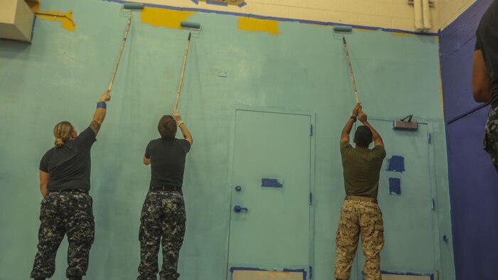 Service members with the 24th Marine Expeditionary Unit paint the gymnasium of the Graham Windham’s Manhattanville Cornerstone Community Center in Manhattan, New York, May 27, 2016. The Marines are visiting the city to interact with the public, demonstrate capabilities and teach the people of New York about America's sea services.