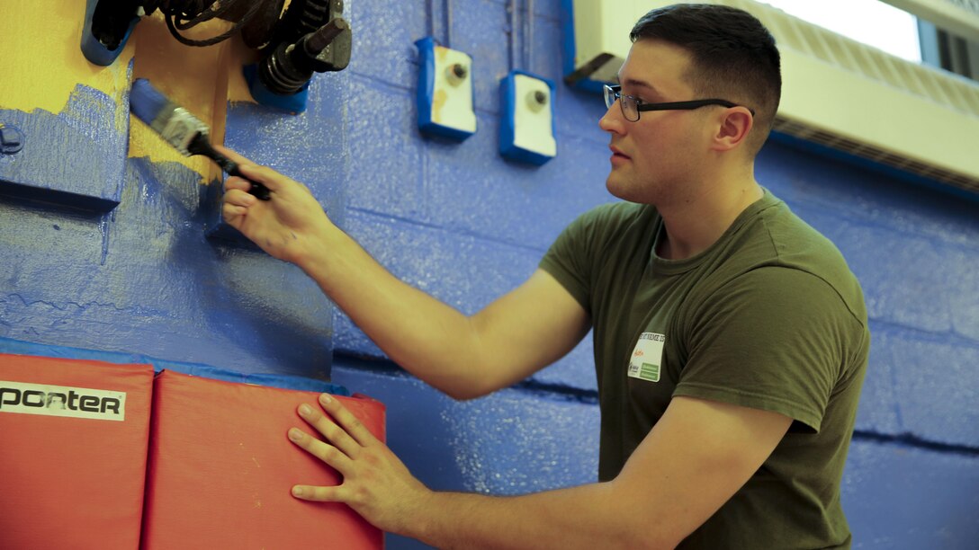 Cpl. Austin Richards, a flight equipment technician with Marine Medium Tiltrotor Squadron 261, paints the gymnasium of the Graham Windham’s Manhattanville Cornerstone Community Center in Manhattan, New York, May 27, 2016. The Marines are visiting the city to interact with the public, demonstrate capabilities and teach the people of New York about America's sea services.