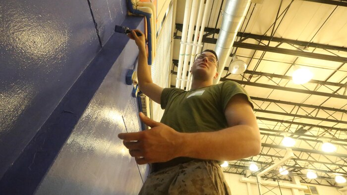 Cpl. Austin Richards, a flight equipment technician with Marine Medium Tiltrotor Squadron 261, paints the gymnasium of the Graham Windham’s Manhattanville Cornerstone Community Center in Manhattan, New York, May 27, 2016. The Marines are visiting the city to interact with the public, demonstrate capabilities and teach the people of New York about America's sea services.