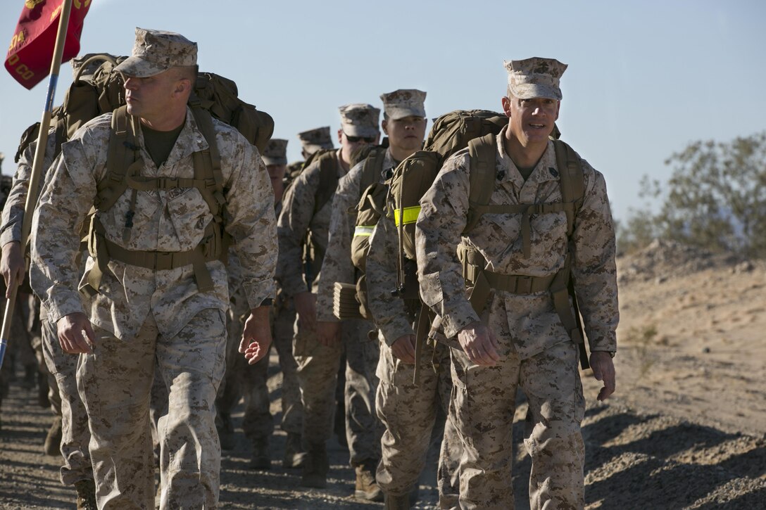 Lt. Col. Steven Murphy, commanding officer, and Sgt. Maj. Chasen E. Getty, squadron sergeant major, Marine Wing Support Squadron 374, lead their Marines from the squadron’s headquarters building to Camp Wilson during a 15 km hike May 6, 2016. This was the last hike MWSS-374 conducted with their current sergeant major and commanding officer. (Official Marine Corps photo by Lance Cpl. Dave Flores/Released)