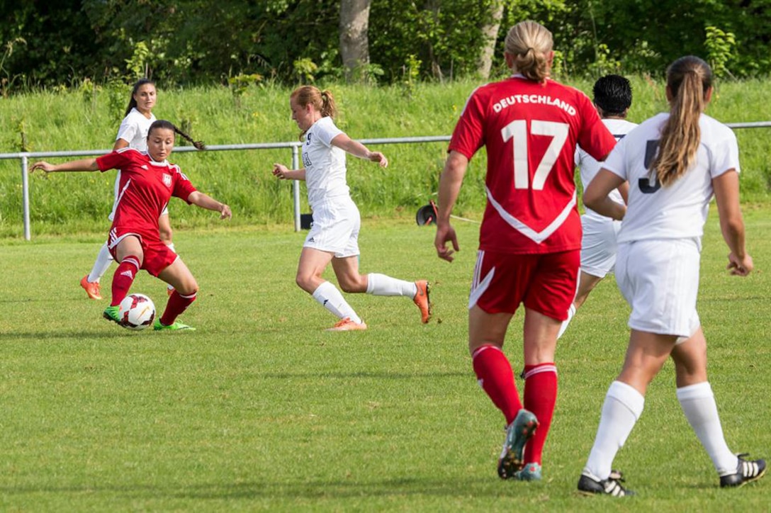 Air Force 2nd lt. Ariel Saltin of JB Charleston, S.C. defends against Germany in their opening match of the 2016 Conseil International du Sport Militaire (CISM) World Women's Football Cup in Rennes, France 24 May to 6 June.  